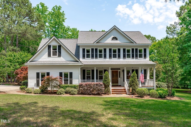 8536 Wolverton Fields Dr, Wake Forest, NC 27587 - view of front facade featuring a front yard, a porch, and a shingled roof