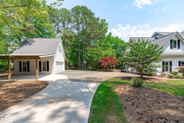 8536 Wolverton Fields Dr, Wake Forest, NC 27587 - view of property's community featuring concrete driveway, a garage, and a carport