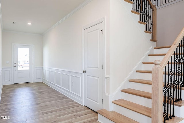 1128 Sun Springs Rd, Wake Forest, NC 27587 - entryway with stairway, wood finished floors, ornamental molding, wainscoting, and recessed lighting