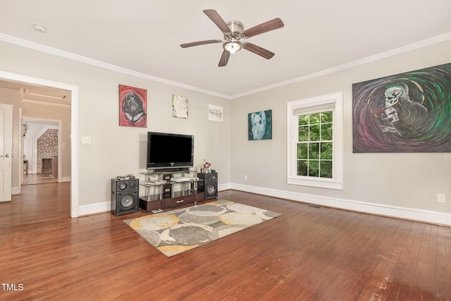 411 E Green St, Franklinton, NC 27525 - living area with wood finished floors, ornamental molding, ceiling fan, and baseboards