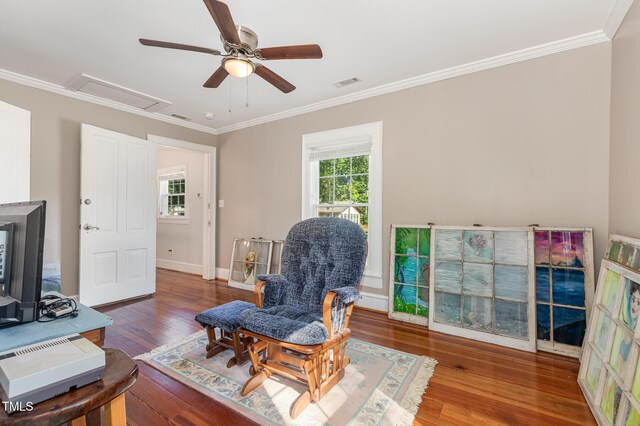 411 E Green St, Franklinton, NC 27525 - sitting room featuring ceiling fan, crown molding, wood-type flooring, and baseboards