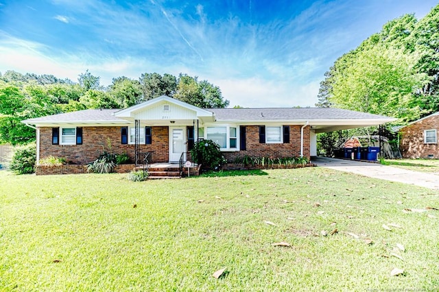 2911 Wicker St, Sanford, NC 27330 - ranch-style house featuring concrete driveway, brick siding, a carport, and a front yard