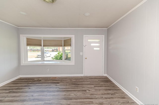 2911 Wicker St, Sanford, NC 27330 - foyer entrance featuring ornamental molding, wood finished floors, and baseboards