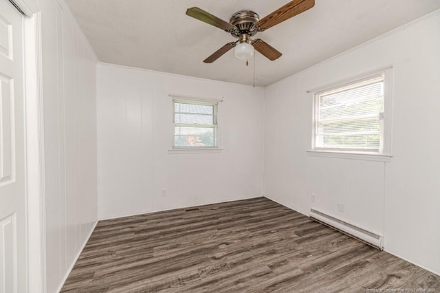 2911 Wicker St, Sanford, NC 27330 - unfurnished room featuring a baseboard radiator, wood finished floors, and a ceiling fan