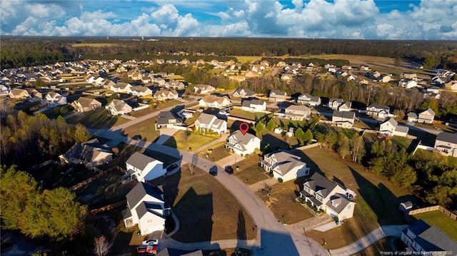 aerial overview of property's location with nearby suburban area