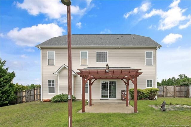 rear view of house with a pergola and a patio area