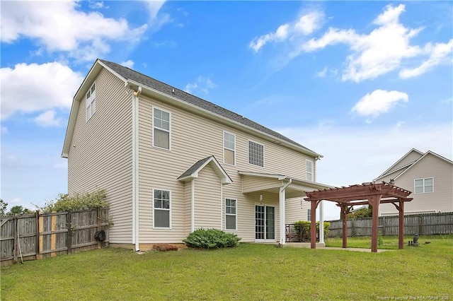 rear view of house featuring a pergola and a patio