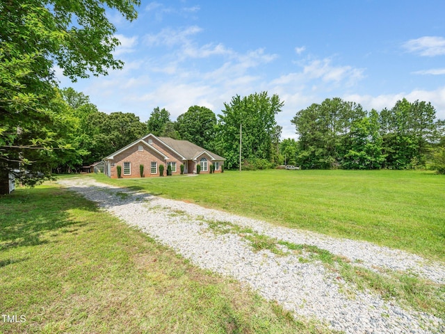 8917 Thompson Mill Rd, Wake Forest, NC 27587 - view of green lawn featuring driveway
