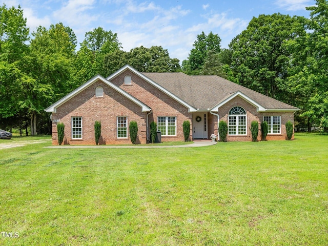 8917 Thompson Mill Rd, Wake Forest, NC 27587 - single story home featuring brick siding and a front lawn