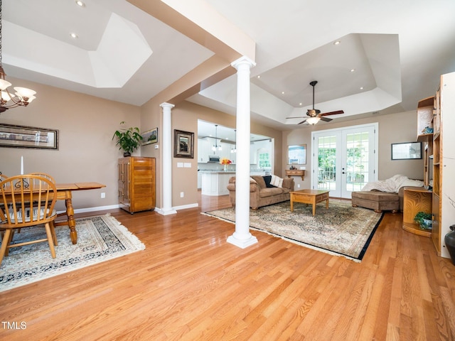 8917 Thompson Mill Rd, Wake Forest, NC 27587 - living room with a raised ceiling, decorative columns, wood finished floors, baseboards, and recessed lighting