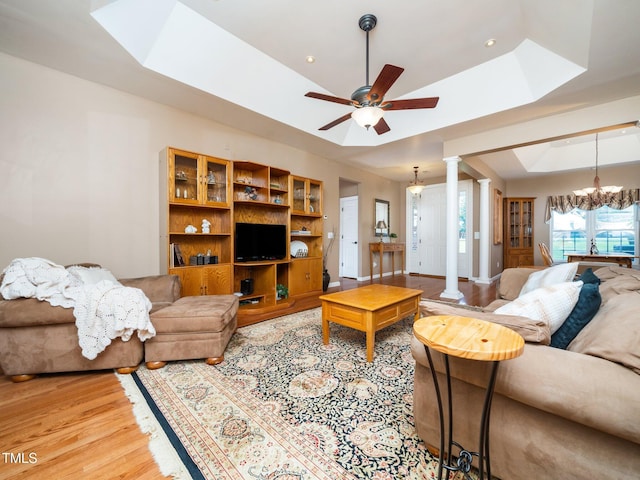 8917 Thompson Mill Rd, Wake Forest, NC 27587 - living area with ornate columns, a skylight, a raised ceiling, ceiling fan, and recessed lighting