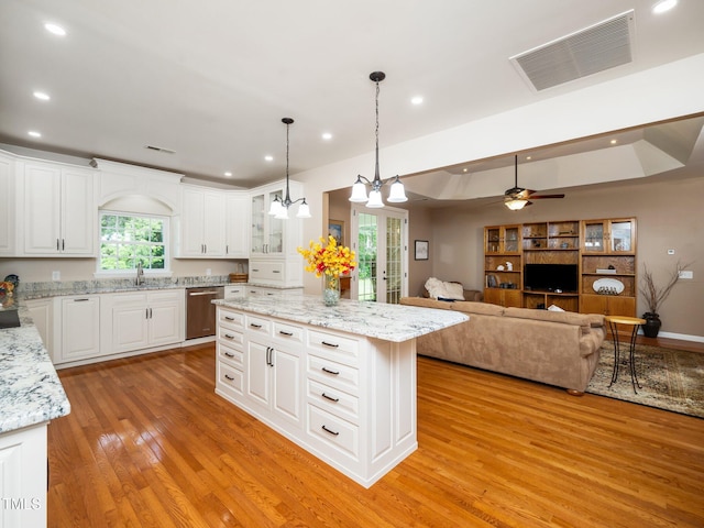 8917 Thompson Mill Rd, Wake Forest, NC 27587 - kitchen with light wood finished floors, a sink, recessed lighting, stainless steel dishwasher, and a kitchen island