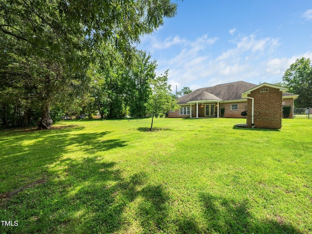 8917 Thompson Mill Rd, Wake Forest, NC 27587 - view of grassy yard featuring french doors