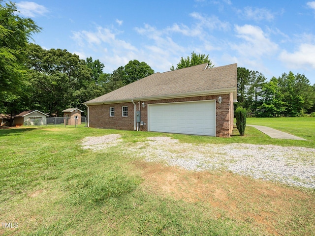 8917 Thompson Mill Rd, Wake Forest, NC 27587 - view of side of property featuring brick siding, roof with shingles, and driveway