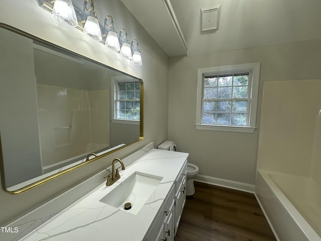 2032 Sherry Lynn Dr, Garner, NC 27529 - full bath featuring toilet, baseboards, wood finished floors, and vanity