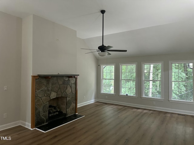 2032 Sherry Lynn Dr, Garner, NC 27529 - unfurnished living room featuring baseboards, wood finished floors, ceiling fan, plenty of natural light, and lofted ceiling