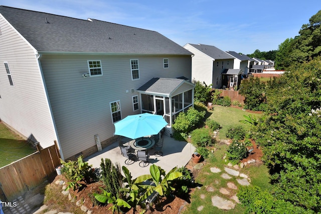 1056 Evening Shade Ave, Rolesville, NC 27571 - rear view of property featuring a sunroom, a patio, and a residential view