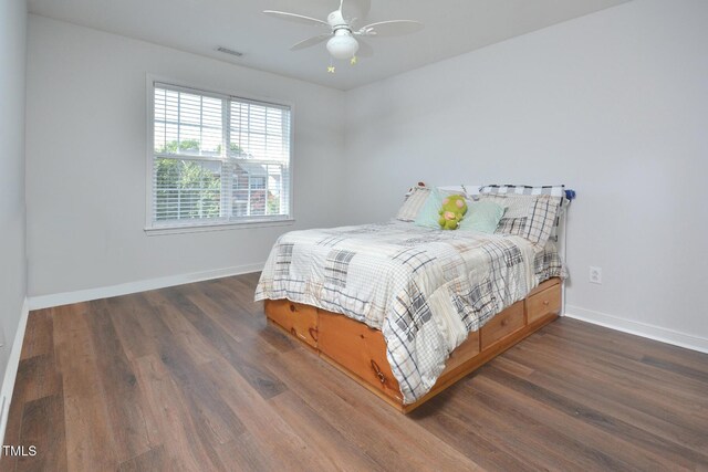 1056 Evening Shade Ave, Rolesville, NC 27571 - bedroom with dark wood finished floors, baseboards, and ceiling fan