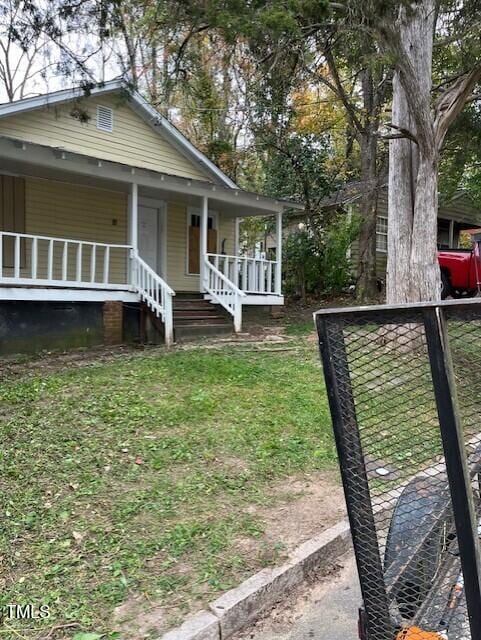 116 Dunstan Ave, Durham, NC 27707 - view of side of home with a porch and a lawn
