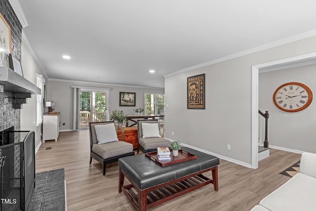 3 Haggis Ct, Durham, NC 27705 - living room featuring crown molding, a brick fireplace, baseboards, light wood-style floors, and recessed lighting