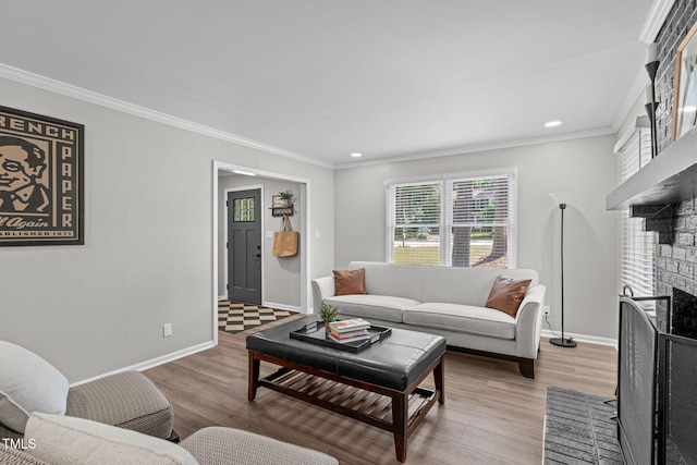 3 Haggis Ct, Durham, NC 27705 - living area featuring wood finished floors, baseboards, ornamental molding, recessed lighting, and a fireplace with flush hearth