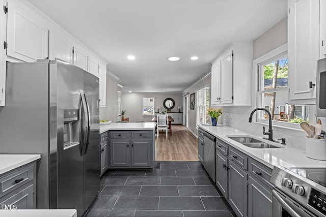 3 Haggis Ct, Durham, NC 27705 - kitchen featuring stainless steel appliances, a sink, gray cabinets, white cabinetry, and recessed lighting
