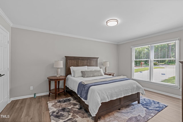 3 Haggis Ct, Durham, NC 27705 - bedroom featuring crown molding, wood finished floors, and baseboards