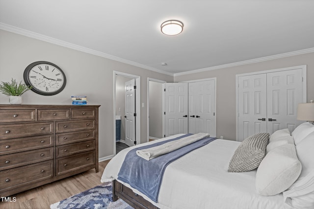 3 Haggis Ct, Durham, NC 27705 - bedroom featuring crown molding, multiple closets, light wood finished floors, baseboards, and ensuite bath