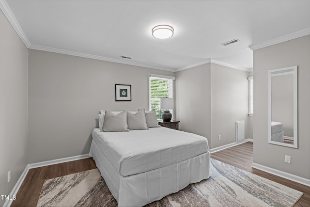 3 Haggis Ct, Durham, NC 27705 - bedroom with wood finished floors, ornamental molding, and baseboards