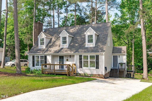 3 Haggis Ct, Durham, NC 27705 - cape cod-style house with a chimney, a front yard, and a wooden deck