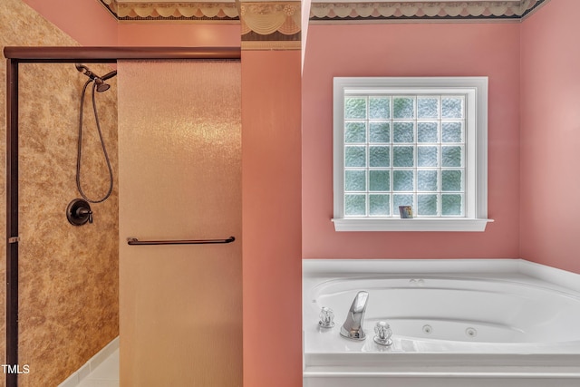 1325 Red Brick Rd, Garner, NC 27529 - bathroom with healthy amount of natural light, a shower stall, and a tub with jets