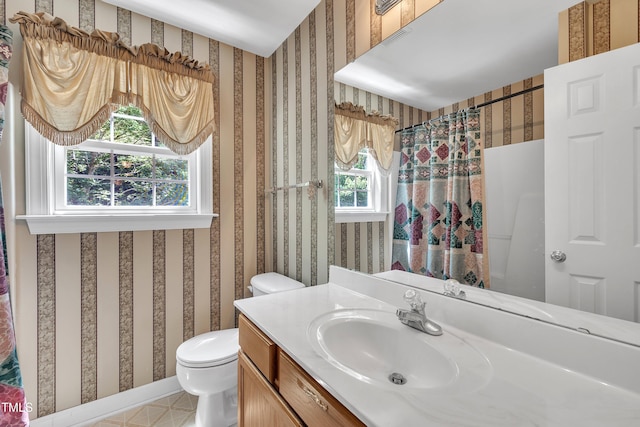 1325 Red Brick Rd, Garner, NC 27529 - bathroom featuring toilet, wallpapered walls, vanity, and a shower with curtain