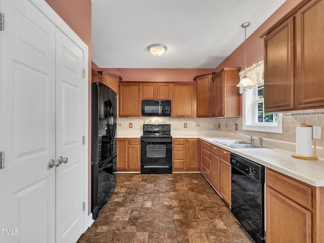 1325 Red Brick Rd, Garner, NC 27529 - kitchen featuring black appliances, a sink, stone finish flooring, backsplash, and light countertops