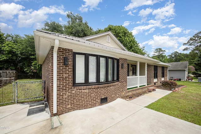 7368 Ryan St, Fayetteville, NC 28314 - single story home featuring brick siding, covered porch, metal roof, and crawl space