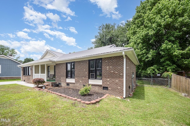 7368 Ryan St, Fayetteville, NC 28314 - view of front of home with brick siding, a porch, metal roof, and crawl space