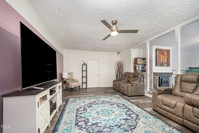 7368 Ryan St, Fayetteville, NC 28314 - living room with a textured ceiling, ceiling fan, wood finished floors, and baseboards