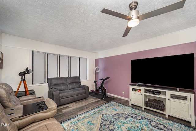 7368 Ryan St, Fayetteville, NC 28314 - living room featuring a textured ceiling, wood finished floors, a ceiling fan, and baseboards