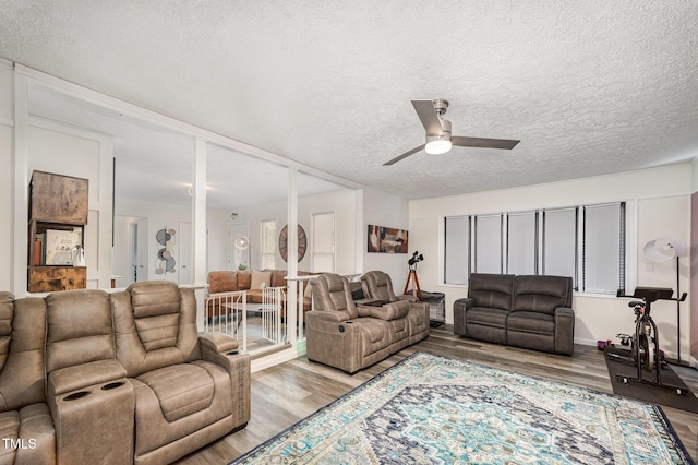 7368 Ryan St, Fayetteville, NC 28314 - living area with ceiling fan, wood finished floors, and a textured ceiling
