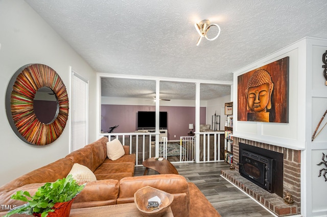 7368 Ryan St, Fayetteville, NC 28314 - living room with a textured ceiling, wood finished floors, and ceiling fan