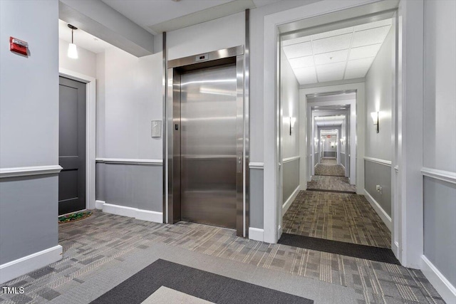 317 W Morgan St Unit 320, Raleigh, NC 27601 - hall with elevator, carpet floors, and baseboards