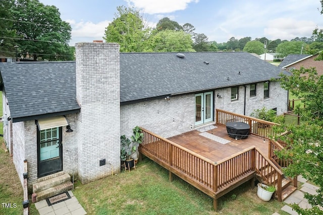 103 Midway Ln, Roanoke Rapids, NC 27870 - back of property featuring roof with shingles, brick siding, and a chimney