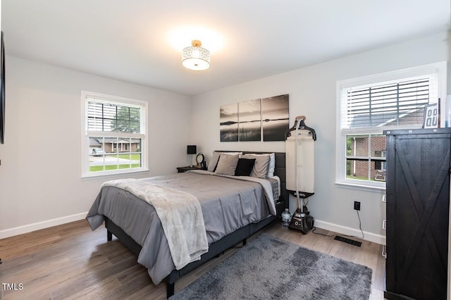 103 Midway Ln, Roanoke Rapids, NC 27870 - bedroom featuring baseboards and wood finished floors