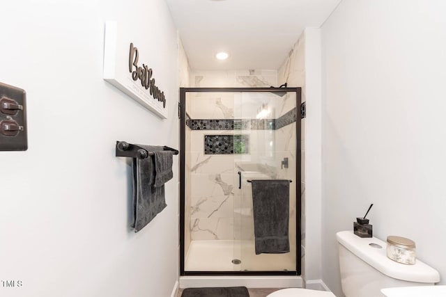 103 Midway Ln, Roanoke Rapids, NC 27870 - bathroom with toilet, a stall shower, and baseboards