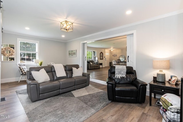 103 Midway Ln, Roanoke Rapids, NC 27870 - living room featuring ornamental molding, baseboards, wood finished floors, and recessed lighting