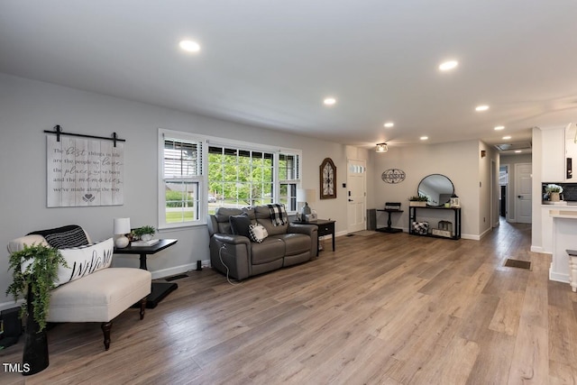 103 Midway Ln, Roanoke Rapids, NC 27870 - living area featuring recessed lighting, light wood finished floors, and baseboards