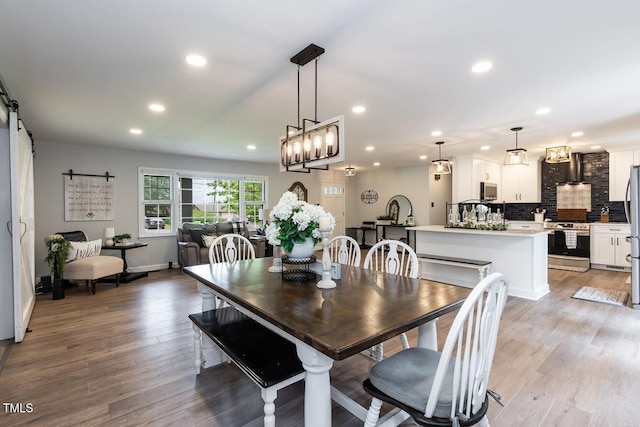 103 Midway Ln, Roanoke Rapids, NC 27870 - dining area with a barn door, recessed lighting, light wood-type flooring, and baseboards