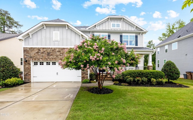 633 Copper Beech Ln, Wake Forest, NC 27587 - craftsman house featuring board and batten siding, stone siding, and a front lawn