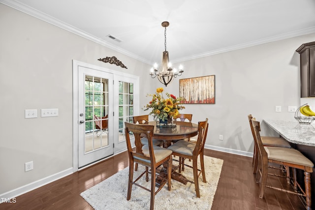 633 Copper Beech Ln, Wake Forest, NC 27587 - dining room featuring a chandelier, crown molding, dark wood-style flooring, and baseboards