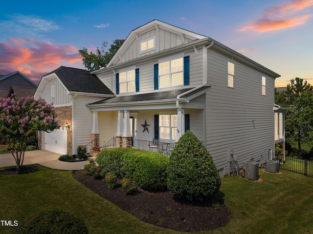 633 Copper Beech Ln, Wake Forest, NC 27587 - view of front facade with a porch, cooling unit, board and batten siding, a shingled roof, and driveway
