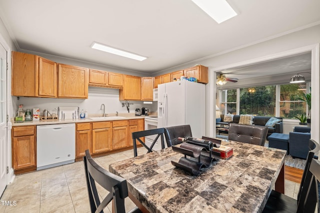 1905 Bivins St, Durham, NC 27707 - kitchen featuring white appliances, a sink, light tile patterned floors, ornamental molding, and light countertops